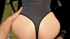 Perfect ass of a hot milf in action on the garden lawn