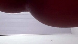A young brunette gets things inside her ass while she masturbates