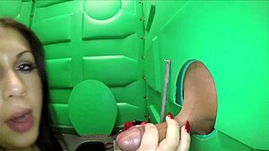 Construction workers have oral sex in the outhouse at a porta-potty site