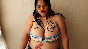 A thick woman with big boobs happily swallows a cum shot