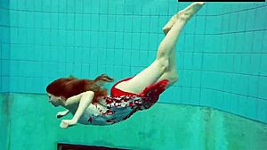 Hot hairy red-haired Polish girl swims naked in the pool