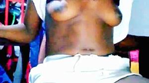 Big black cock fucking an African slut in a doggy style position
