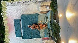 Monika Fox, a Russian pornstar, indulges in solo session on the bed
