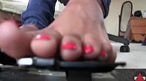 Sensual foot massage with red toenails