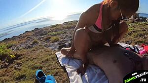 Gay couple enjoys barebacking on public beach