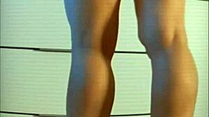 Blonde hotel receptionist in short skirt and heels awaits room keys